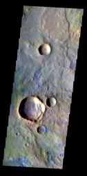 The THEMIS VIS camera contains 5 filters. The data from different filters can be combined in multiple ways to create a false color image. This false color image from NASA's 2001 Mars Odyssey spacecraft shows part of the plains of Terra Cimmeria.