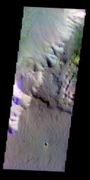 The THEMIS VIS camera contains 5 filters. The data from different filters can be combined in multiple ways to create a false color image. This false color image from NASA's 2001 Mars Odyssey spacecraft shows the highland - chasma margin.