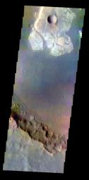 The THEMIS VIS camera contains 5 filters. Data from different filters can be combined in many ways to create a false color image. This image from NASA's 2001 Mars Odyssey spacecraft shows a unique, resistant material on the floor of an unnamed crater.