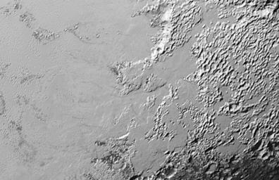 Ice (probably frozen nitrogen) that appears to have accumulated on the uplands on the right side of this image from NASA's New Horizons, is draining from Pluto's mountains onto the informally named Sputnik Planum.