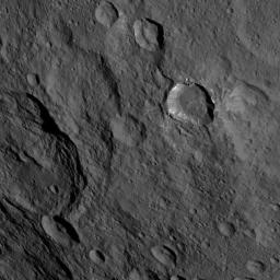 This image, taken by NASA's Dawn spacecraft, shows a portion of the southern hemisphere of dwarf planet Ceres from an altitude of 915 miles (1,470 kilometers). Toharu crater, named for the Pawnee god of food and vegetation, can be seen at left.