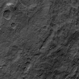 This image, taken by NASA's Dawn spacecraft, shows the surface of dwarf planet Ceres from an altitude of 915 miles (1,470 kilometers) around mid-latitudes. The unusual mountain Ahuna Mons is featured here.