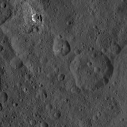 This image of Ceres, taken by NASA's Dawn spacecraft, shows three prominent craters located to the northeast of a terrace (the terrace feature being located at left in this image).