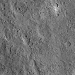 This view of Ceres from NASA's Dawn spacecraft shows cratered terrain located immediately to the west of the intriguing mountain feature called Ahuna Mons.