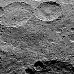 This image of Ceres, taken by NASA's Dawn spacecraft, shows Sintana Crater (36 miles, 58 kilometers wide) at top, just right of center. The rim of a large crater called Zadeni (80 miles, 128 kilometers wide), is seen at the bottom of the image.