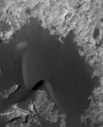 This is a frame from an animation that flips back and forth between views taken in 2010 and 2014 of a Martian sand dune at the edge of Mount Sharp, documenting dune activity.