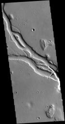 This image captured by NASA's 2001 Mars Odyssey spacecraft shows a portion of Hebrus Valles. This channel system was formed by liquid flow of either water or lava, or a combination of both.