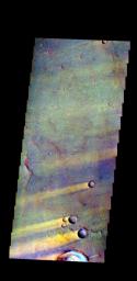 The THEMIS camera contains 5 filters. The data from different filters can be combined in many ways to create a false color image. This image from NASA's 2001 Mars Odyssey spacecraft shows windstreaks located on Syrtis Major Planum east of Nili Patera.