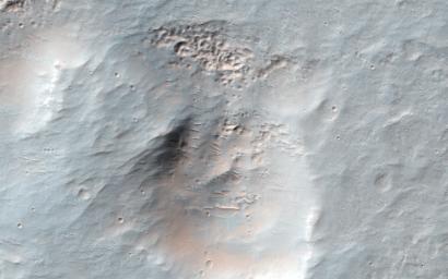This image from NASA's Mars Reconnaissance Orbiter spacecraft shows an interesting collection of kilometer-scale craters with flat and smooth floors. The craters themselves may be caused by debris from a distant larger impact.