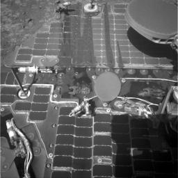 This image from the navigation camera on the mast of NASA's Mars Exploration Rover Opportunity shows streaks of dust or sand on the vehicle's rear solar panel after a series of drives during which the rover was pointed steeply uphill.