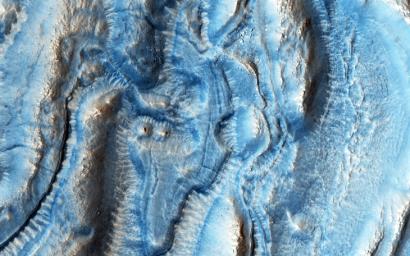 This image was taken by NASA's Mars Reconnaissance Orbiter spacecraft, in one of the regions on Mars well-known for its viscous flow features (VFF), which are massive flowing deposits believed to be composed of a mixture of ice and dust.