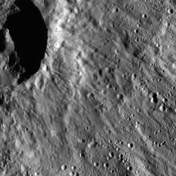 This image from NASA's Dawn spacecraft shows a scene located at mid-latitudes in the southern hemisphere of Ceres. The view features a portion of a crater between the large impact features Urvara and Yalode.