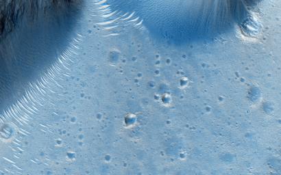 This image from NASA's Mars Reconnaissance Orbiter spacecraft shows the northern rim of a crater in Deuteronilus. At the northern end, we see the crater rim and ridges inside and below that rim.