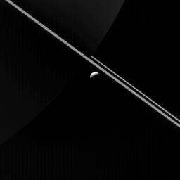 At first glance, the most obvious features in this image from NASA's Cassini spacecraft are Saturn's rings and the icy moon Enceladus. Upon closer inspection, Saturn's night side is also visible.