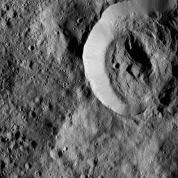 This view from NASA's Dawn spacecraft features a smooth-walled impact crater in the northern hemisphere of Ceres. The view is centered at approximately 65 degrees north latitude, 155 degrees east longitude.