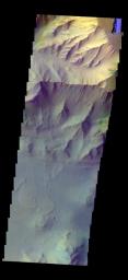 The THEMIS camera contains 5 filters. The data from different filters can be combined in multiple ways to create a false color image. This image from NASA's 2001 Mars Odyssey spacecraft shows part of Coprates Chasma.