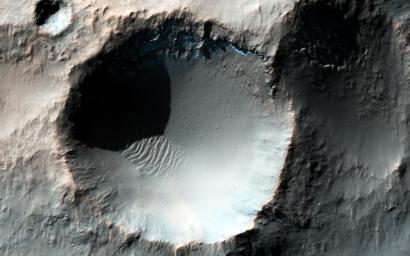 This enhanced color image from NASA's Mars Reconnaissance Orbiter spacecraft shows several craters somewhere in the southern mid-latitudes of Mars.