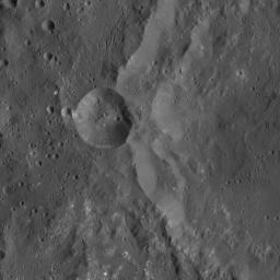 This image from NASA's Dawn spacecraft shows the western rim of Azacca Crater on Ceres. A smaller impact feature sits on its flank. Of particular interest in this scene is the great number of small, bright spots, in the southern part of the image.