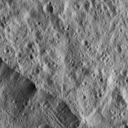 This picture from NASA's Dawn spacecraft shows a portion of the northeastern rim of Yalode Crater, one of the largest impact features on Ceres. A set of narrow, roughly parallel fractures can be seen at top center.