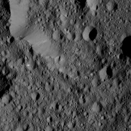 NASA's Dawn spacecraft took this view from Ceres on June 16, 2016, showing Ernutet Crater (32 miles, 52 kilometers in diameter) at top.