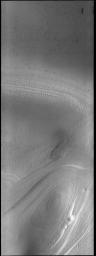 Southern hemisphere spring has arrived at the south polar cap. The ice layers that make up the cap are easily seen in this image from NASA's 2001 Mars Odyssey spacecraft.