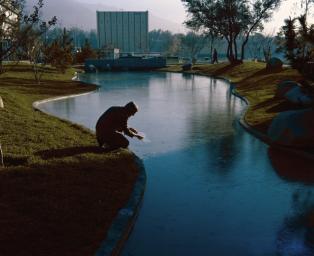 This archival photograph from 1971 shows the open-air gathering area at NASA's Jet Propulsion Laboratory known as 'The Mall.' It looks east towards the Applied Mechanics building.