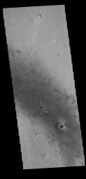 This image captured by NASA's 2001 Mars Odyssey spacecraft shows some of the numerous dark linear streaks on the floor of Gusev Crater. These streaks are formed by wind action.