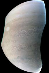 This image, taken by NASA's Juno spacecraft's JunoCam imager, highlights the seventh of Jupiter's eight 'string of pearls,' massive counterclockwise rotating storms that appear as white ovals in the gas giants southern hemisphere.