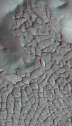 This anaglyph from NASA's Mars Reconnaissance Orbiter shows part of Gordi Dorsum in the Medusae Fossae region of Mars, shows part of an area on Mars where narrow rock ridges, some as tall as a 16-story building.