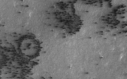 In this image captured by NASA's Mars Reconnaissance Orbiter, the terrain is covered with a seasonal layer of dry ice.
