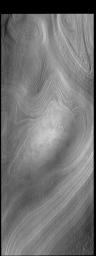 This image captured by NASA's 2001 Mars Odyssey spacecraft shows part of the south polar cap. It is now summer in the region and the surface frosts are gone.