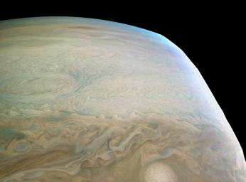 This enhanced color Jupiter image, taken by the JunoCam imager on NASA's Juno spacecraft, showcases several interesting features on the apparent edge (limb) of the planet.
