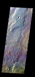The THEMIS camera contains 5 filters. The data from different filters can be combined in multiple ways to create a false color image. This image from NASA's 2001 Mars Odyssey spacecraft shows a small portion of Daedalia Planum.