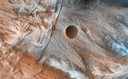Viscous, lobate flow features are commonly found at the bases of slopes in the mid-latitudes of Mars, and are often associated with gullies, as seen by NASA's Mars Reconnaissance Orbiter.