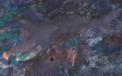 The collision that created Hargraves Crater impacted into diverse bedrock lithologies of ancient Mars; the impact ejecta is a rich mix of rock types with different colors and textures, as seen by NASA's Mars Reconnaissance Orbiter.