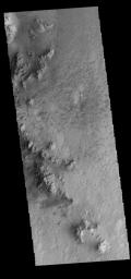Rather than a central peak, Hale Crater contains a complex ridge of peaks. This image captured by NASA's 2001 Mars Odyssey spacecraft shows a portion of the ridge.