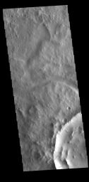 This image captured by NASA's 2001 Mars Odyssey spacecraft shows several dark slope streaks on the inner rim of an unnamed crater in Terra Sabaea.