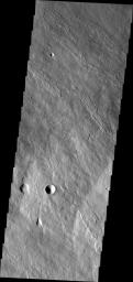 This image of the flank of Ascraeus Mons obtained by NASA's 2001 Mars Odyssey spacecraft shows several individual flows where the sides are higher than the center.