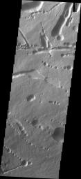 This image captured by NASA's 2001 Mars Odyssey spacecraft shows part of the northeastern flank of Ascraeus Mons, along the trend that joins the three large Tharsis volcanoes.