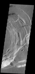 This image captured by NASA's 2001 Mars Odyssey spacecraft shows the eastern part of the complex caldera at the summit of Ascraeus Mons on Mars.