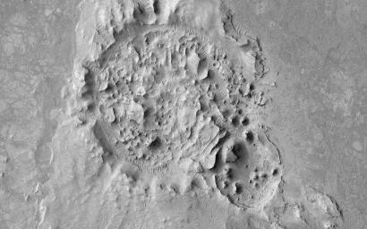 This image from NASA's Mars Reconnaissance Orbiter shows a crater is located in Elysium Planitia, Mars, an area dominated by volcanic processes. It is likely that the crater fill material is volcanic in origin.