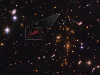 NASA's Hubble Space Telescope shows the farthest galaxy yet seen in an image that has been stretched and amplified by a phenomenon called gravitational lensing.