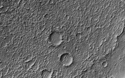 This image from NASA's Mars Reconnaissance Orbiter (MRO) shows Mars' surface in detail. This particular site on Mars was first imaged in 1965 by the Mariner 4 spacecraft during the first successful fly-by mission to Mars.