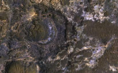 Ladon Basin was a large impact structure that was filled in by the deposits from Ladon Valles, a major ancient river on Mars as seen in this image from NASA's Mars Reconnaissance Orbiter (MRO).
