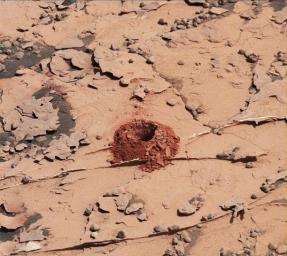 A close-up image of a 2-inch-deep hole produced using a new drilling technique for NASA's Curiosity rover. Curiosity drilled this hole in a target called 'Duluth' on May 20, 2018.