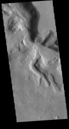 The northern margin of Terra Sabaea is a complex area between a cratered highland and complexly eroded lower plains. This image of the region captured by NASA's 2001 Mars Odyssey spacecraft shows just one of the numerous unnamed channels.