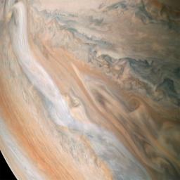 NASA's Juno spacecraft shows a white jet stream speeding through Jupiter's atmosphere. The jet stream, called Jet N2, was captured along the dynamic northern temperate belts of the gas giant planet.