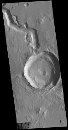 This image from NASA's Mars Odyssey shows a crater on Hephaestus Fossae. The crater is fairly young, as there is only minimal modification of the crater floor.