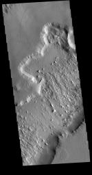 This image from NASA's Mars Odyssey shows the northern end of Gordii Dorsum, where the surface slopes down into southern Amazonis Planitia. Dark slope streaks are visible on the lower cliff face.