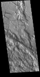 This image from NASA's Mars Odyssey shows shows part of Aram Chaos. Aram Chaos was initially formed by a large impact. Over time the crater interior was modified by several different processes, including liquid water.